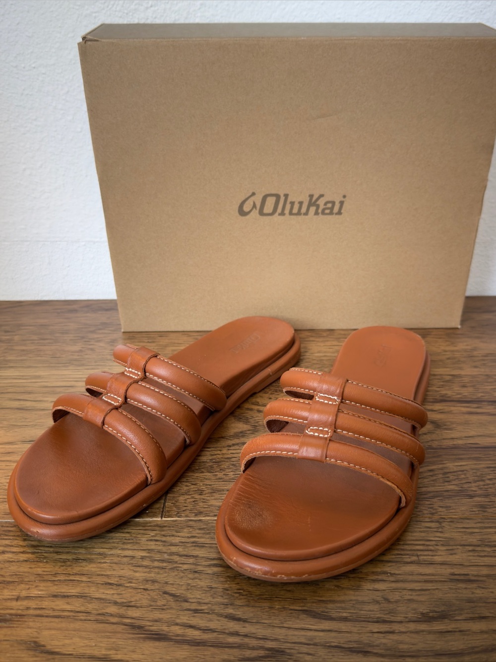 OluKai Tiare Triple-Strap Leather Slides — Chestnut
